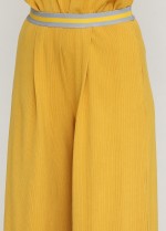 Желтые широкие брюки с карманами фото 2